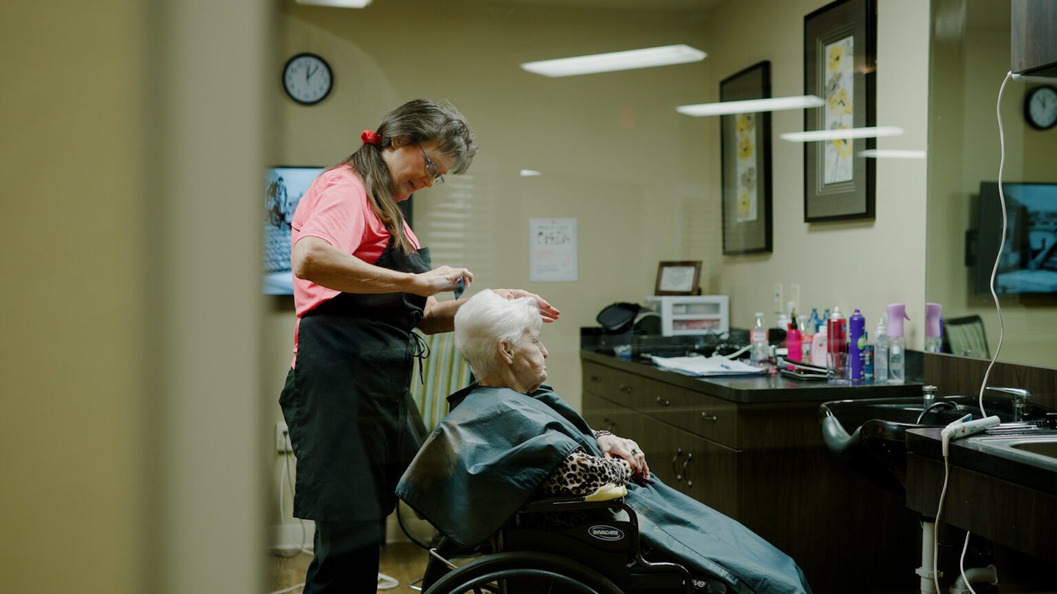 A woman at Amberwood Health and Rehab takes advantage of the salon available at this skilled nursing facility