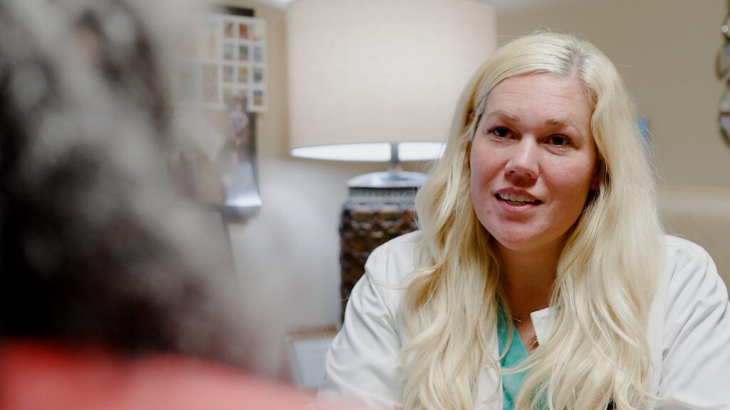 A nurse providing resources at a skilled nursing facility